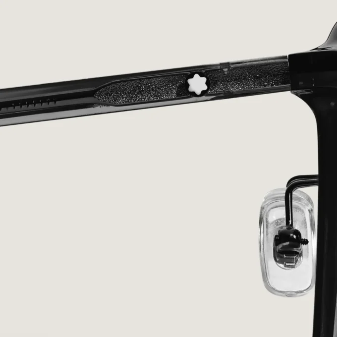 Occhiali da sole ovali con montatura in acetato nero