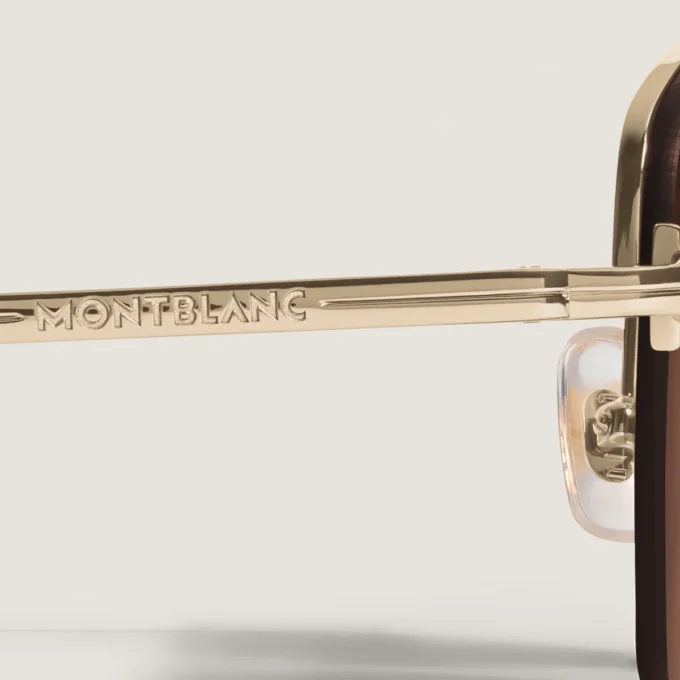 Occhiali da sole ovali con montatura in metallo color oro